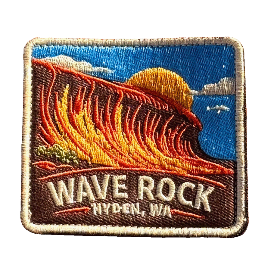 Hyden - Wave Rock embroidered travel patch with the curved rock formation of Wave Rock; photographed on a transparent background.