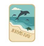 Jervis Bay illustrated travel patch design featuring dolphins leaping offshore and a turtle swimming beside a sandy beach.