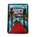 Joop's Jetty - Harrietville embroidered travel patch with a wooden jetty and Joop‚Äôs Jetty sign above a lake with a canoe; photographed on a transparent background.