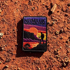 Katherine Gorge (Nitmiluk) embroidered travel patch with a hiker silhouetted against an orange sunset and gorge cliffs at Nitmiluk National Park.