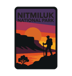 Katherine Gorge (Nitmiluk) illustrated travel patch design featuring a hiker silhouetted against an orange sunset and gorge cliffs at Nitmiluk National Park.