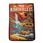 The Kimberleys embroidered travel patch with a waterfall, helicopter, cattle and four-wheel drive in a rugged Kimberley gorge; photographed on a transparent background.