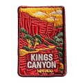Kings Canyon (Watarrka) embroidered travel patch with red sandstone canyon walls and trees in Watarrka National Park; photographed on a transparent background.