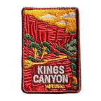 Kings Canyon (Watarrka) embroidered travel patch with red sandstone canyon walls and trees in Watarrka National Park; photographed on a transparent background.