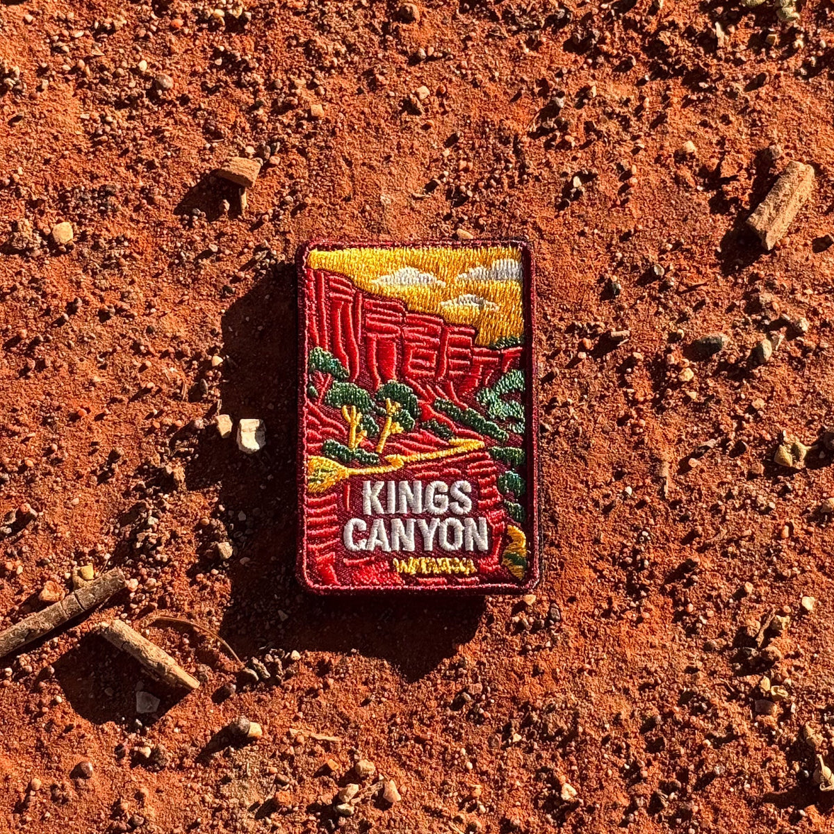 Kings Canyon (Watarrka) embroidered travel patch with red sandstone canyon walls and trees in Watarrka National Park.