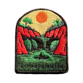 Lawn Hill (Boodjamulla) embroidered travel patch with a person canoeing through a green river between red cliffs at Boodjamulla; photographed on a transparent background.