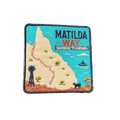 Matilda Way embroidered travel patch with a Queensland route map from Barringun to Kurumba, with a windmill, cattle and a boat; photographed on a transparent background.