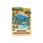 Mount Kosciouzko embroidered travel patch with a snow-covered mountain, alpine cabin, trees and a horse; photographed on a transparent background.
