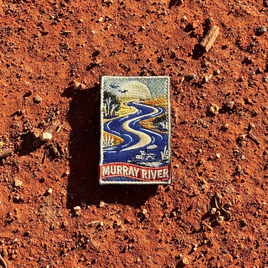 Murray River embroidered travel patch with a winding blue river with a paddle steamer, birds and riverbank trees.