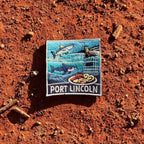 Port Lincoln embroidered travel patch with a tuna, great white shark, sea lion, cage-diving cage and seafood platter.