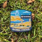 Quobba Blowholes embroidered travel patch with a coastal blowhole spraying above rugged cliffs and ocean.
