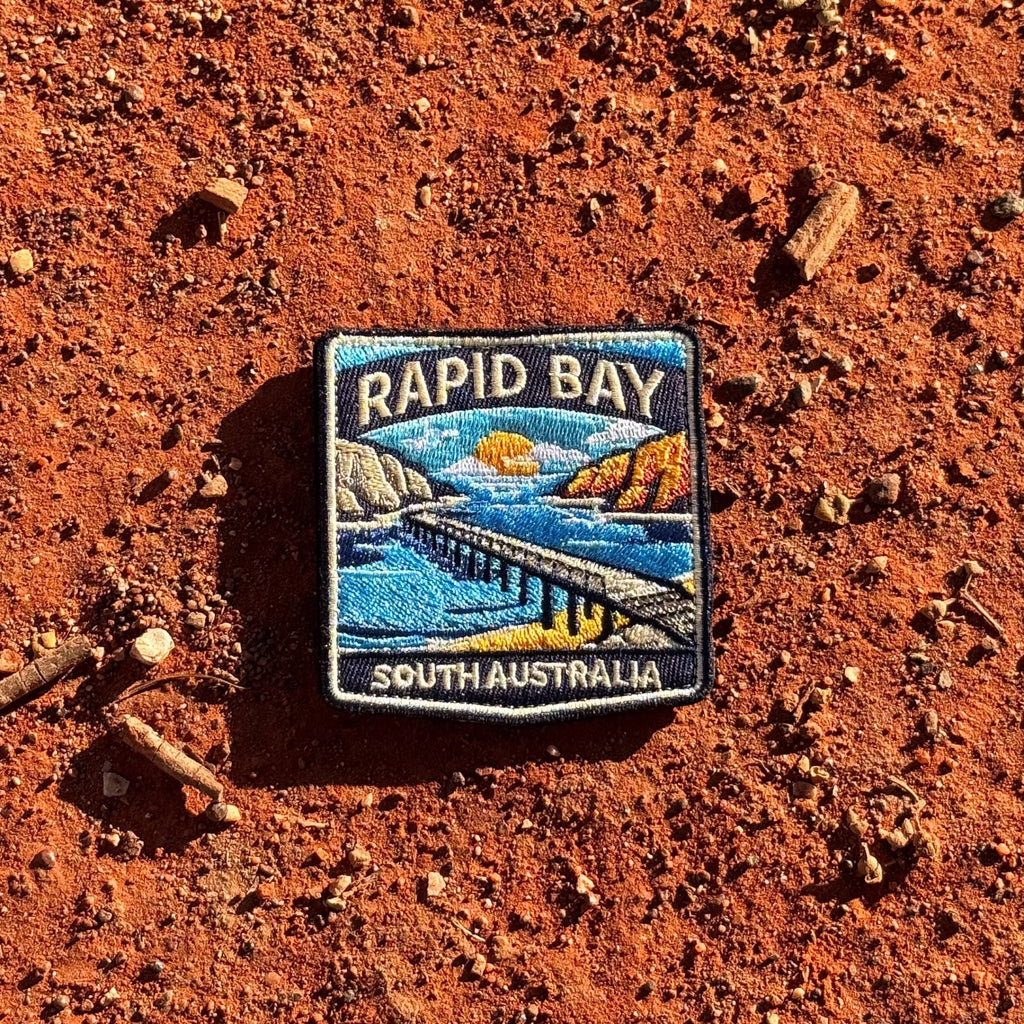 Rapid Bay embroidered travel patch with a long jetty above turquoise coastal water.