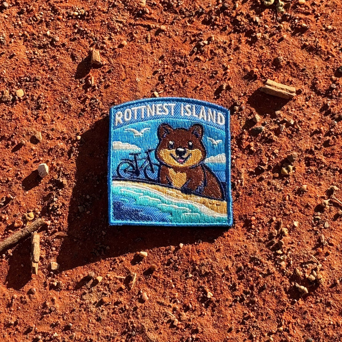 Rottnest Island embroidered travel patch with a quokka and an island beach with turquoise water.