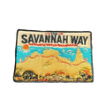 Savannah Way embroidered travel patch with a four-wheel drive travelling a red dirt road across northern Australia; photographed on a transparent background.