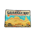 Savannah Way embroidered travel patch with a four-wheel drive travelling a red dirt road across northern Australia; photographed on a transparent background.