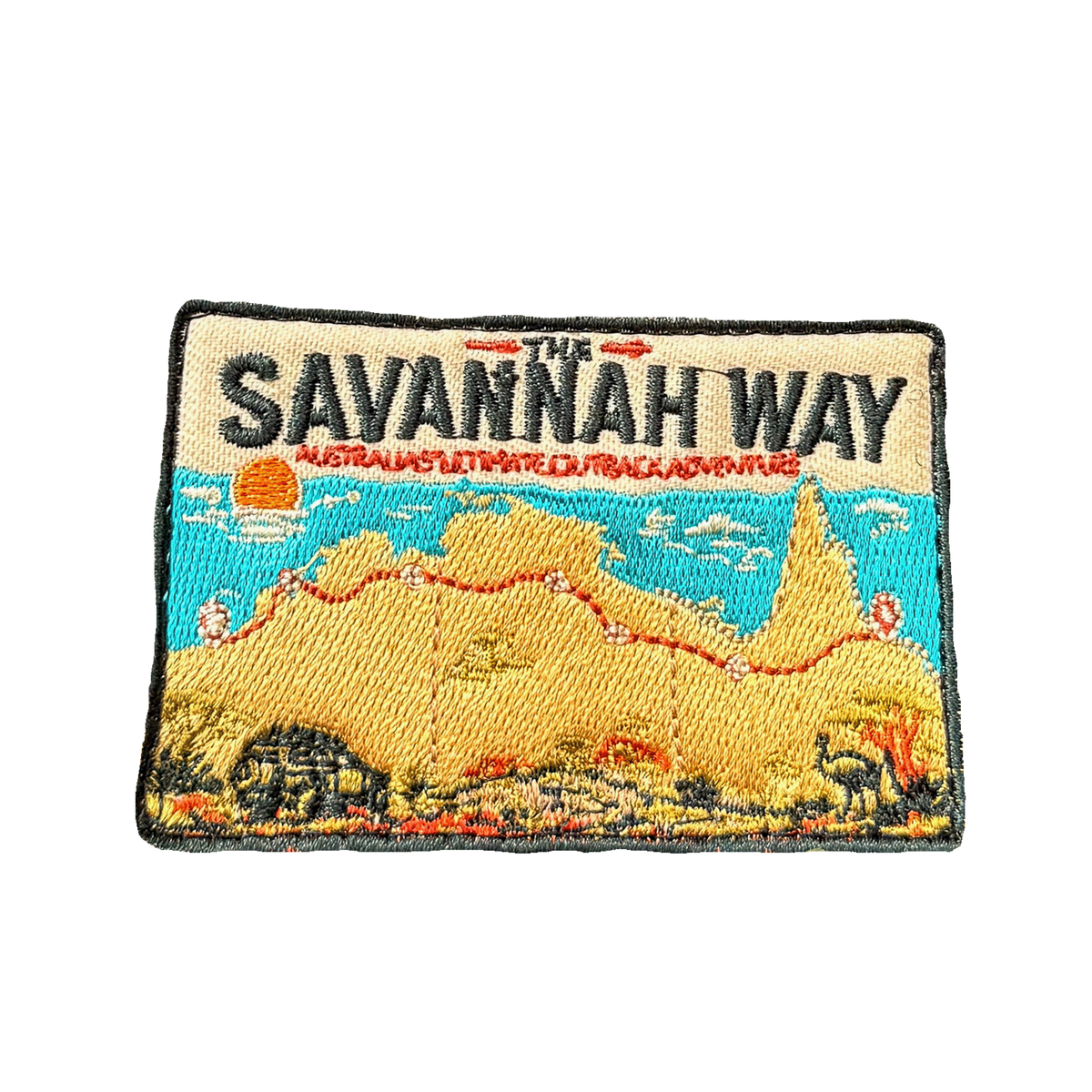 Savannah Way embroidered travel patch with a four-wheel drive travelling a red dirt road across northern Australia; photographed on a transparent background.