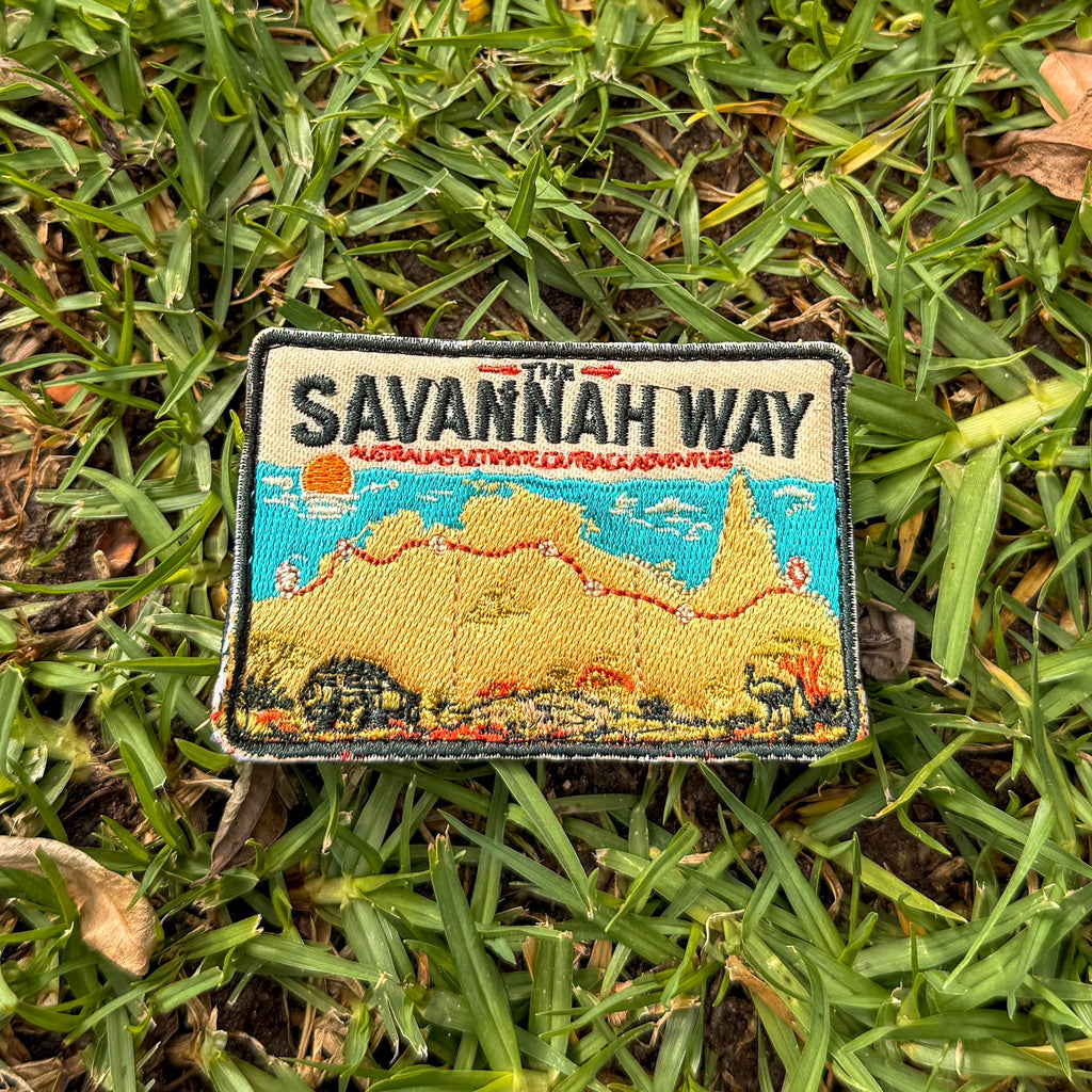 Savannah Way embroidered travel patch with a four-wheel drive travelling a red dirt road across northern Australia.