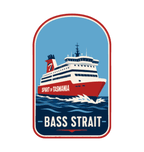 Spirit of Tasmania - Bass Strait illustrated travel patch design featuring red and white Spirit of Tasmania ferry sailing through dark blue Bass Strait waves.