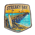 Streaky Bay embroidered travel patch with a sandy coastline and turquoise water; photographed on a transparent background.