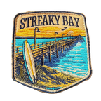 Streaky Bay embroidered travel patch with a sandy coastline and turquoise water; photographed on a transparent background.