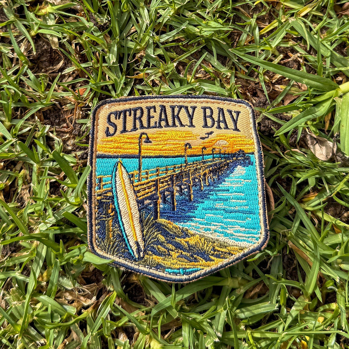 Streaky Bay embroidered travel patch with a sandy coastline and turquoise water.