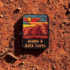 Uluru-Kata Tjuta embroidered travel patch with Uluru and Kata Tjuta rising from red desert country.
