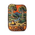 Victorian High Country embroidered travel patch with a four-wheel drive climbing a steep alpine dirt track; photographed on a transparent background.