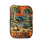 Victorian High Country embroidered travel patch with a four-wheel drive climbing a steep alpine dirt track; photographed on a transparent background.