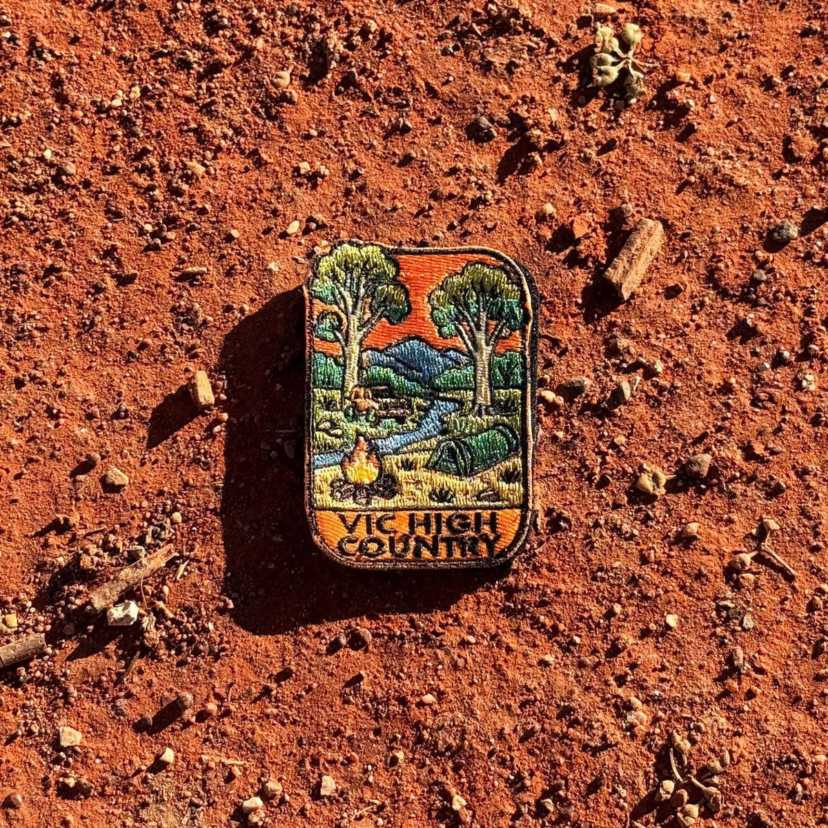 Victorian High Country embroidered travel patch with a four-wheel drive climbing a steep alpine dirt track.