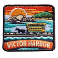 Victor Harbor embroidered travel patch with a horse-drawn tram travelling across the causeway; photographed on a transparent background.