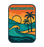 Whitsundays illustrated travel patch design featuring a tropical island beach with palm trees, curling wave and sunset.
