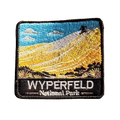 Wyperfeld National Park embroidered travel patch with a sandboarder on a towering pale sand dune above scrubland; photographed on a transparent background.